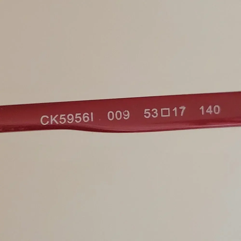 Calvin Klein CK59561 model featuring a black and red frame design 53X17X140